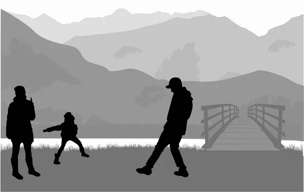 Silhouette Familie auf einem Spaziergang. — Stockvektor