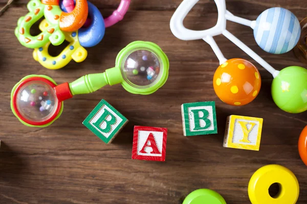 Children's World toy on a wooden background. — Stock Photo, Image