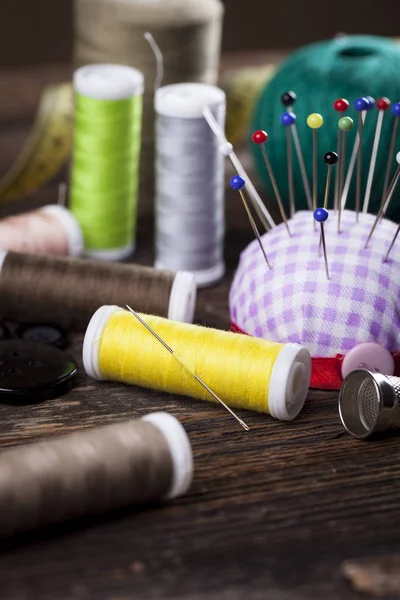Sewing instruments, threads, needles, bobbins and materials. — Stock Photo, Image