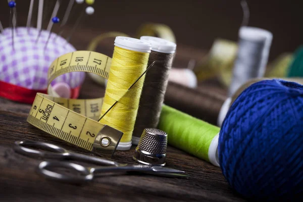 Sewing instruments, threads, needles, bobbins and materials.