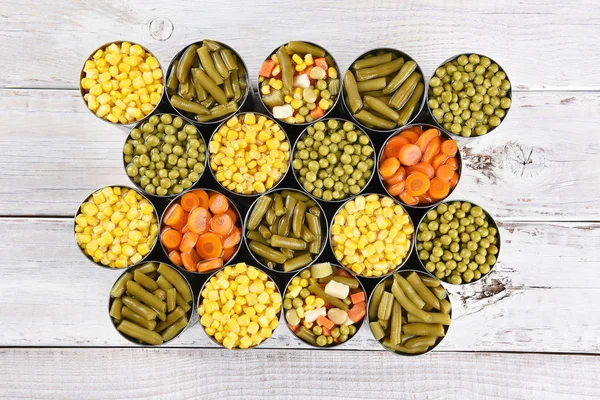 Konserve sebzeler ahşap masa — Stok fotoğraf