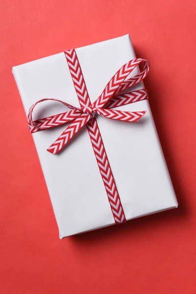 White paper wrapped Christmas present — Stock Photo, Image