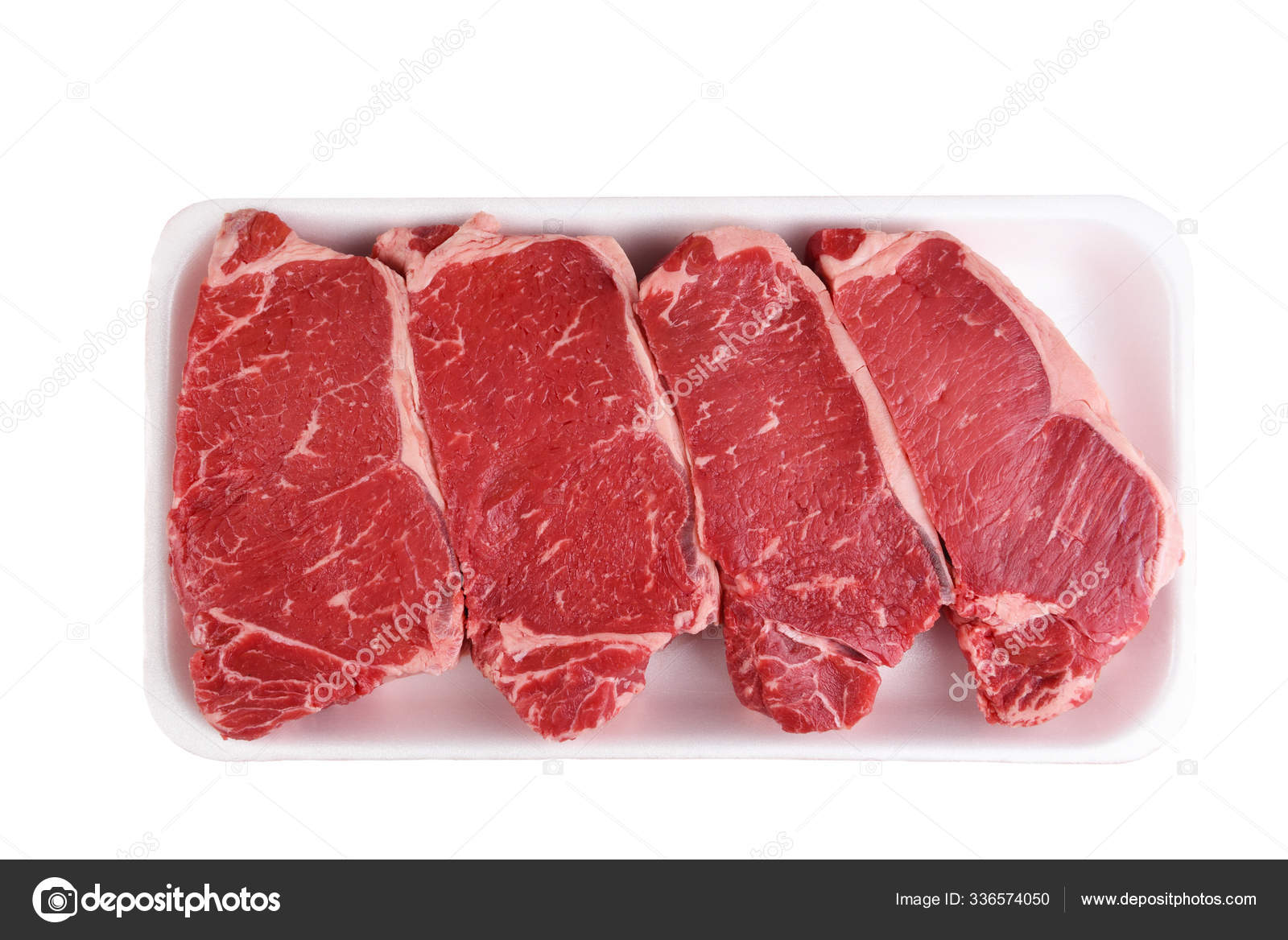 Four Boneless Beef Loin New York Steaks in a styrofoam tray isol Stock