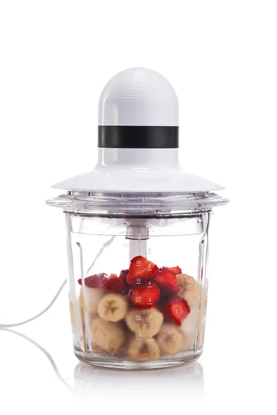 Electric Blender filled with different fruits isolated — Stock Photo, Image