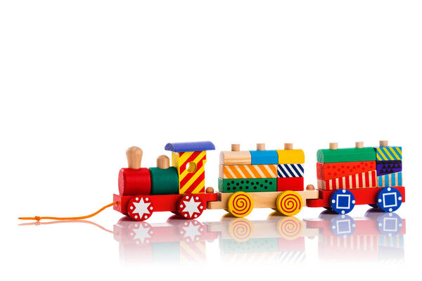 Wooden toy train with colorful blocks isolated on white