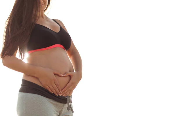 Ciąży Joga i morze Wschodu. Kobieta w ciąży uprawianie sportu w na — Zdjęcie stockowe