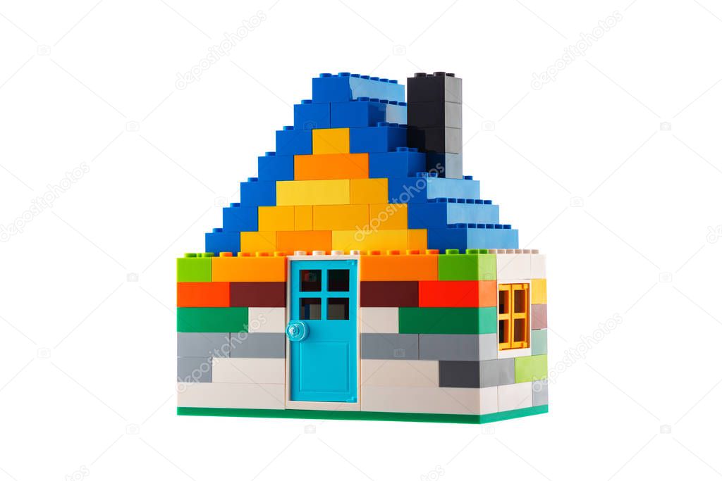 House made of classic building blocks, white studio backgroun