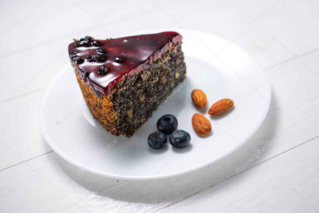 Cake with berry fruits, chia cereals and nuts isolated on white 