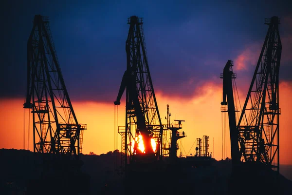 Sunset over sea port and industrial cranes, Varna, Bulgaria — Stock Photo, Image