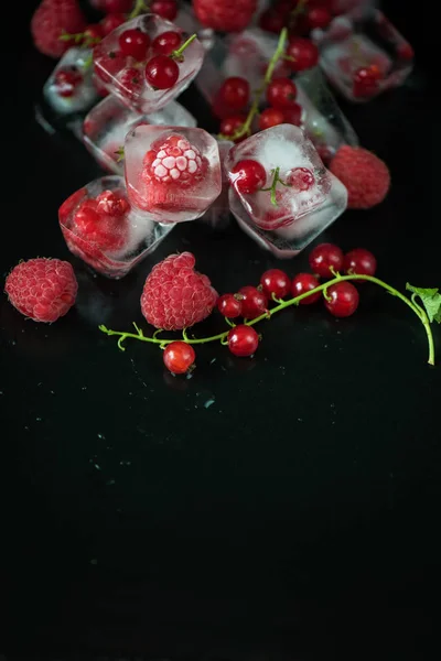 Frozen berries on wooden table — Stock Photo, Image