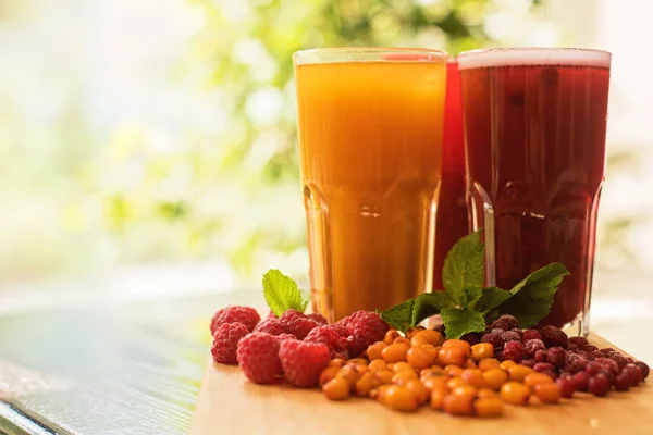 Fruit drink with cranberries raspberries and sea buckthorn — Stock Photo, Image