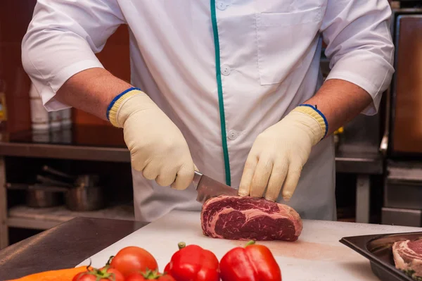 Chef cutting meat — Stock Photo, Image