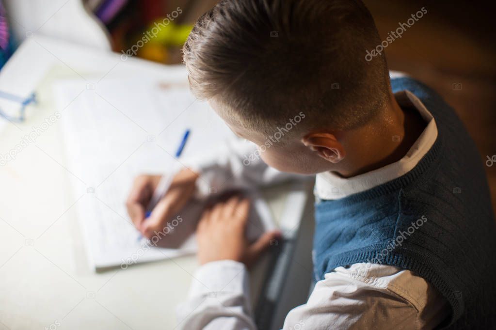 pupil boy does his homework
