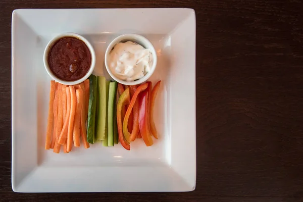 Fresh carrot cucumber pepper and two sauce — Stock Photo, Image