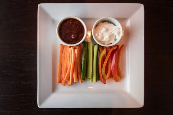 Fresh carrot cucumber pepper and two sauce — Stock Photo, Image