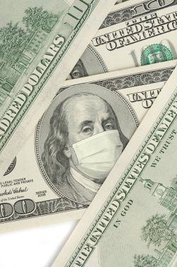 Portrait of Franklin on 100 dollar banknote with medical mask