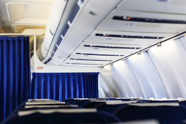 Panel and blue seats inside aircraft — Stock Photo, Image