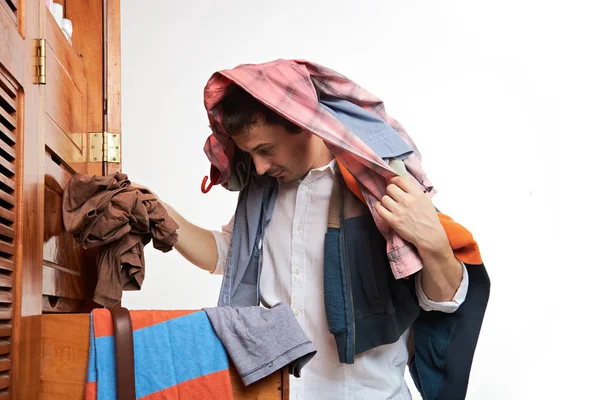 Man choosing clothes — Stock Photo, Image