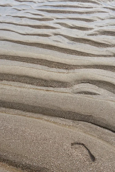 Menselijke voet afdrukken op zand — Stockfoto