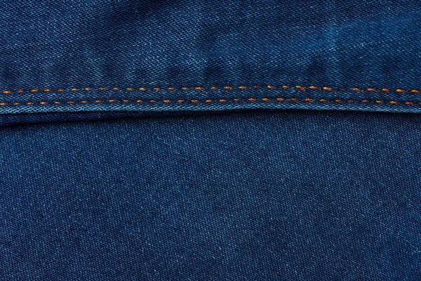 Cuciture orizzontali su sfondo jeans — Foto Stock