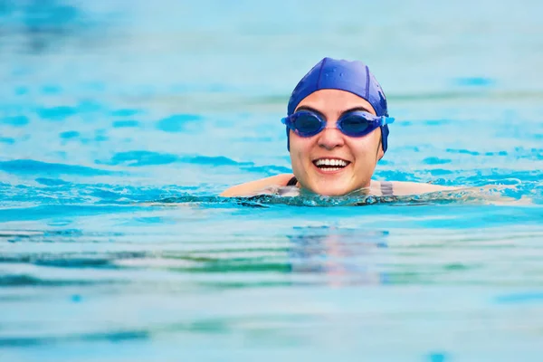 Smiling swimming woman