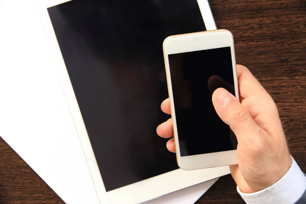 White smartphone in hand — Stock Photo, Image