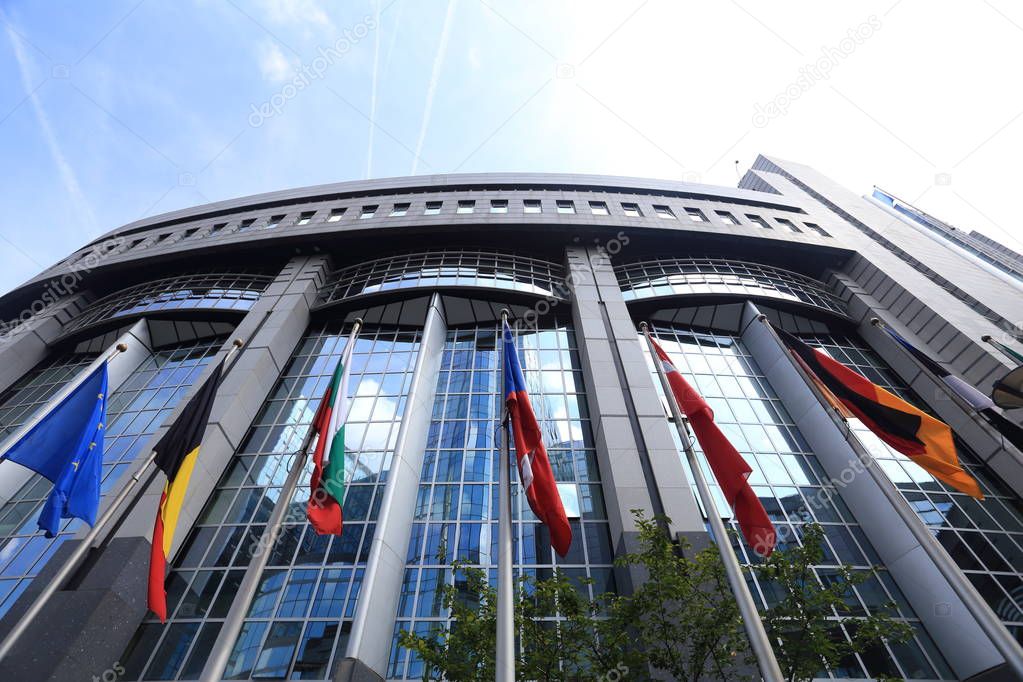 Flags on European Parliament building background – Stock Editorial