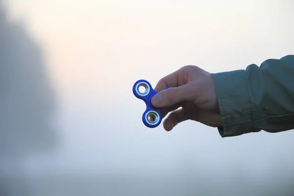 Spinner in man 's hand — стоковое фото