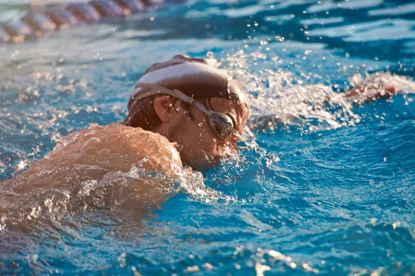 Man take part in swimming competition