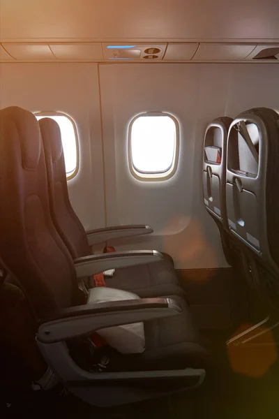 Airplane seat next to window — Stock Photo, Image