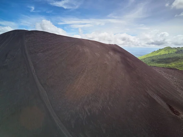 People slide from volcano ash — Stock Photo, Image