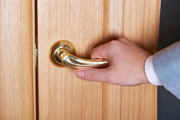 Close-up of hand on door handle