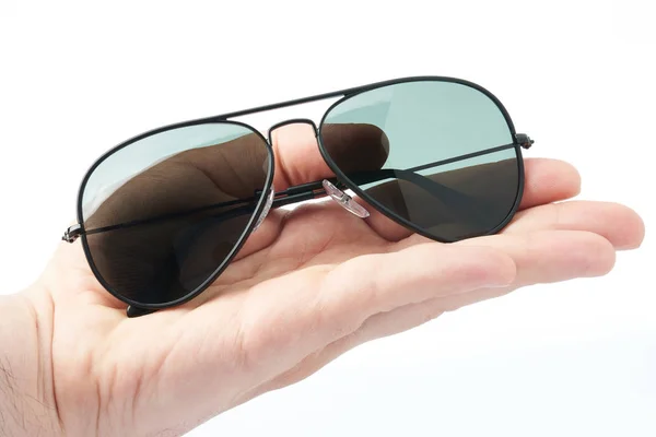 Hand hold polarized sunglasses — Stock Photo, Image