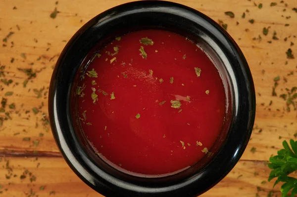 Bowl with ketchup and herbs — Stock Photo, Image