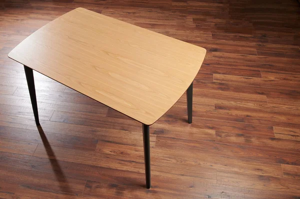 Wooden table with black legs — 스톡 사진