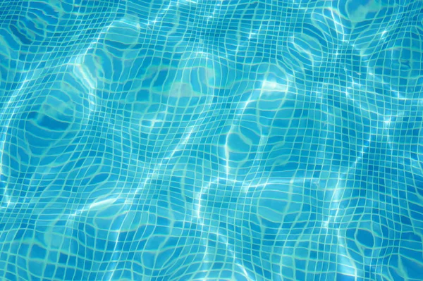 Bright blue bottom of swimming pool — Stock Photo, Image