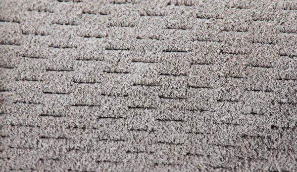 Fundo de tecido macio cinza perfurado — Fotografia de Stock