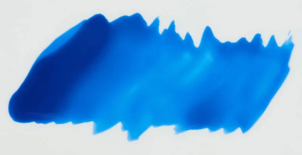 Mancha de tinta azul brilhante isolado — Fotografia de Stock