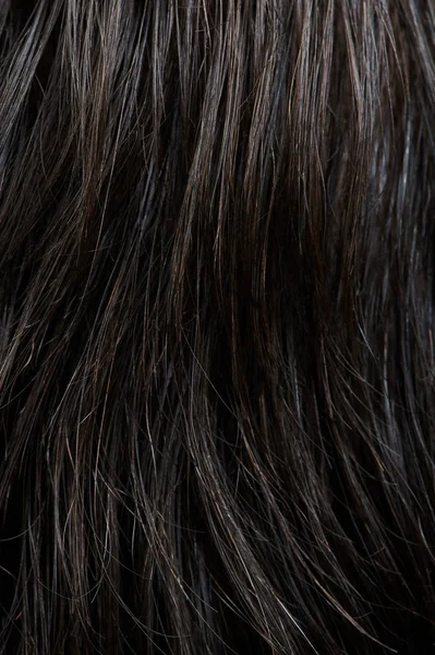Tmavé kudrnaté vlasy — Stock fotografie