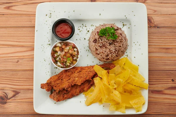 Carne Frita Con Plátano Plato Sobre Mesa Madera Vista Superior —  Fotos de Stock