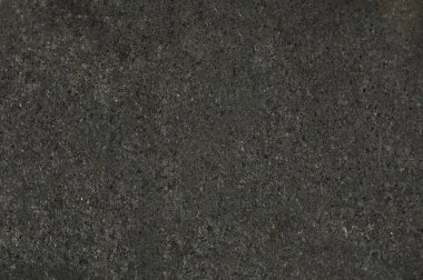 Siyah lekeli koyu gri metalik yüzey yakın görüş