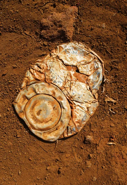 Old crushed rusty tin can — Stock Photo, Image