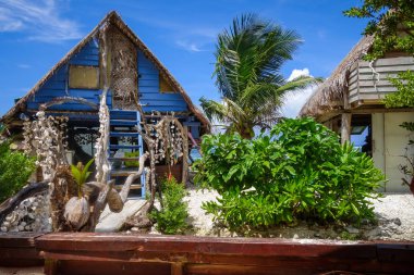 Traditional tropical hut the beach in Moorea Island clipart