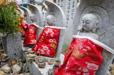 Jizo statues in Arashiyama temple, Kyoto, Japan clipart