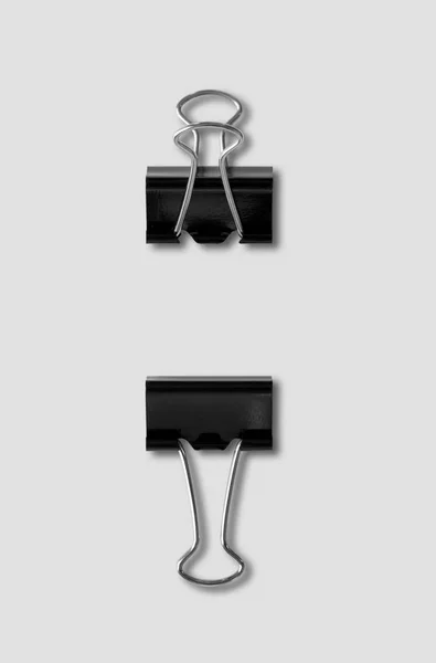 Bulldog clips isolated on grey background — Stock Photo, Image