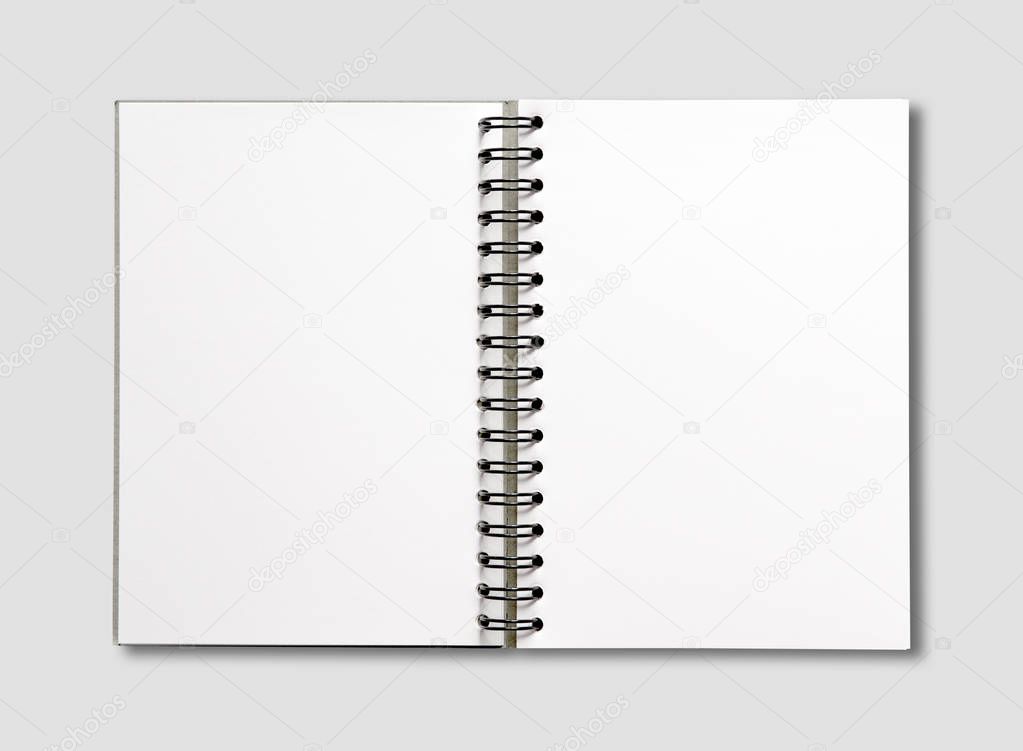 Blank open spiral notebook isolated on grey
