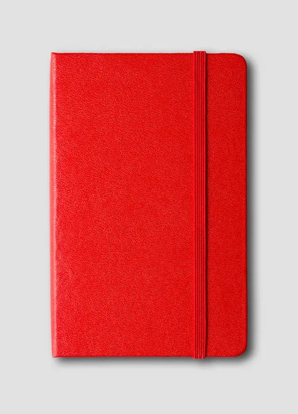 Червоний закритий блокнот ізольований на сірому — стокове фото