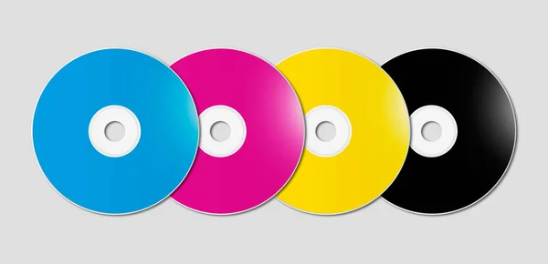 Cmyk Cd - DVD-uppsättning på grå bakgrund — Stockfoto