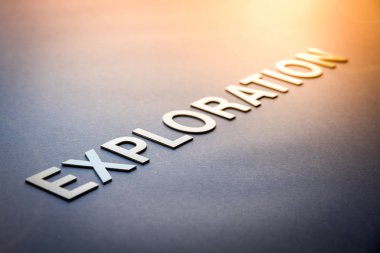 Word exploration written with white solid letters