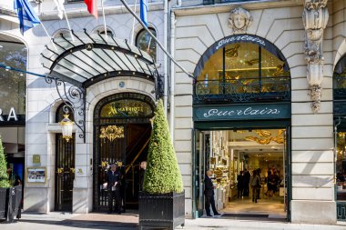 Paris/France - September 10, 2019 : The Guerlain store and Marriott luxury hotel entrance on Champs-Elysees avenue